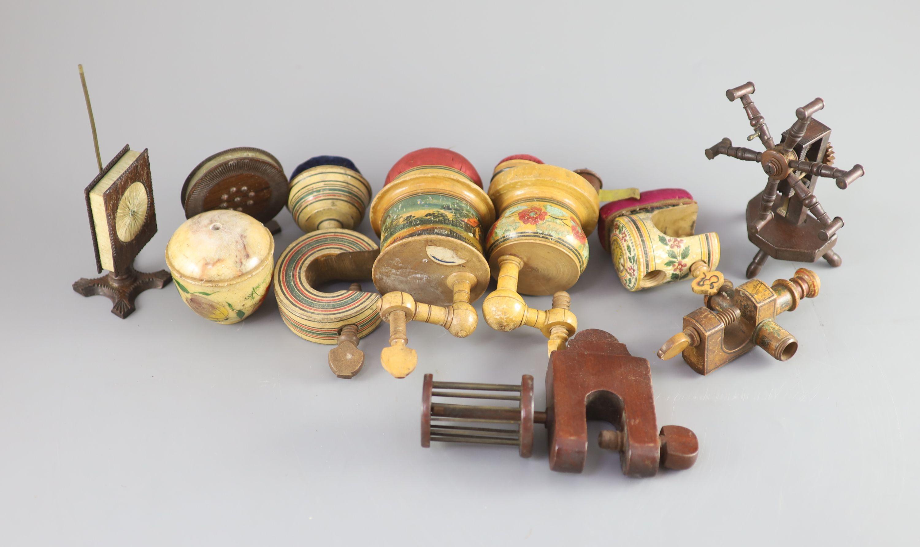 A collection of assorted Victorian sewing clamps and other accessories